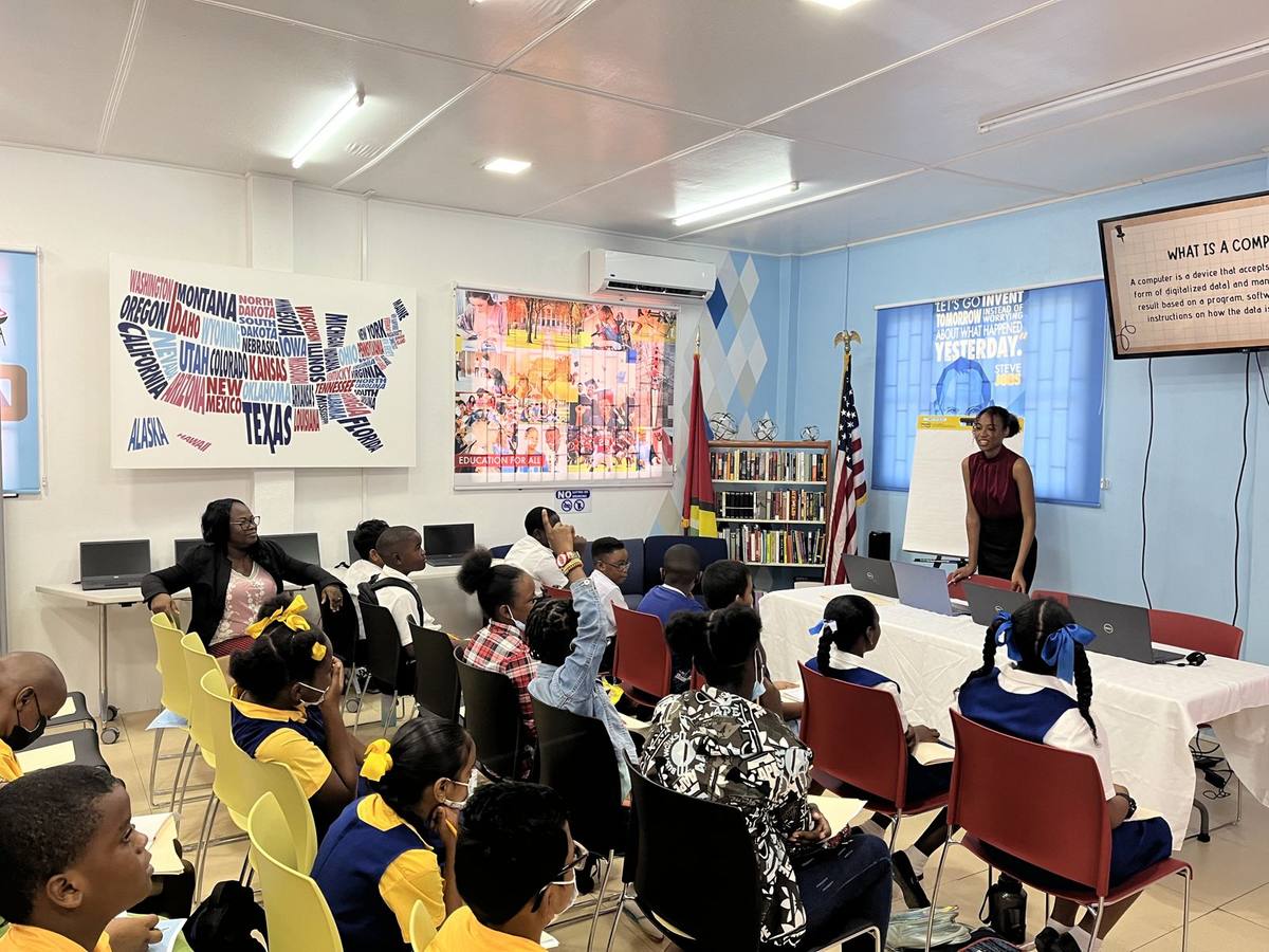 A Next Step mentor leading a session for a room of primary and secondary school students